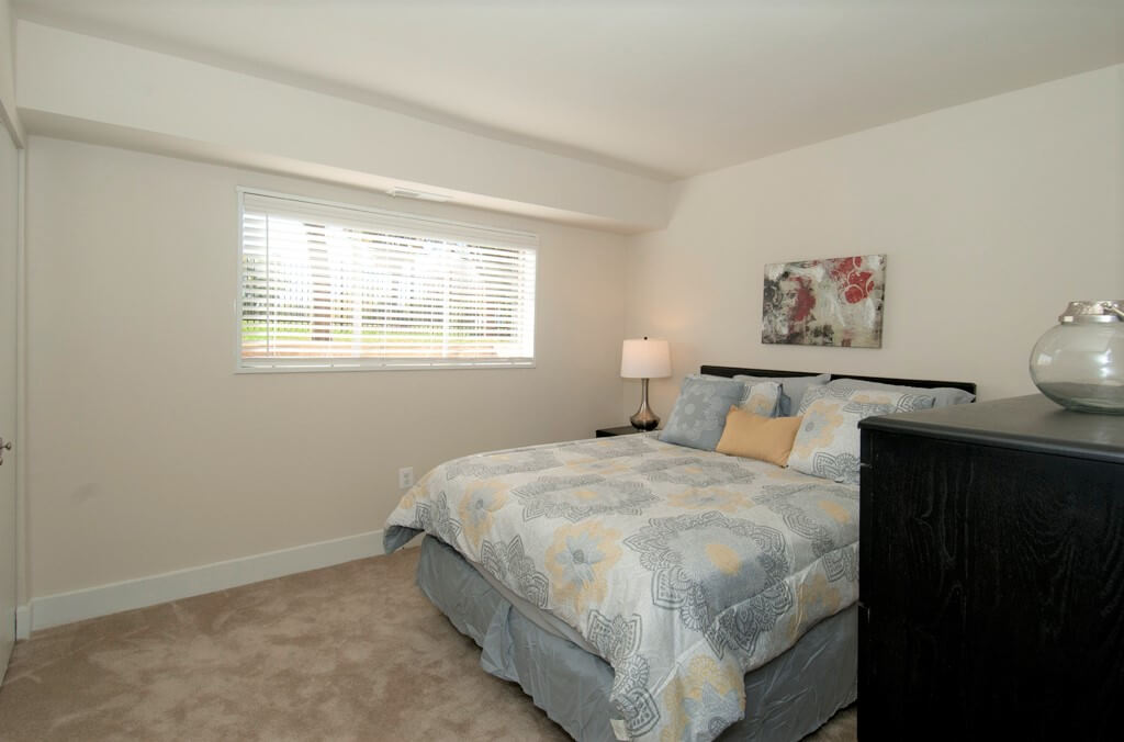 bedroom with furniture and window auden place apartments Glenmont Metro